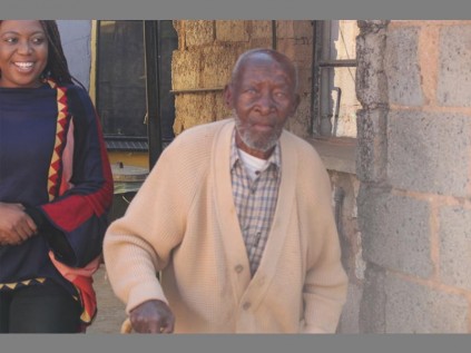 SONGSTRESS Nkiyase Mondlana with Alex's oldest citizen, Johannes Mdelwa Nkosi, who will finally get a toilet of his own.