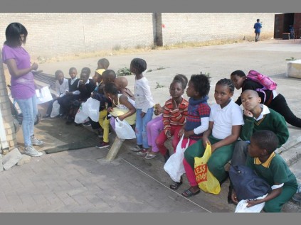 Busisiwe Danisa registers children for their after school feeding at Mveledzo Development Organisation.