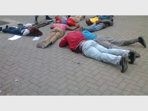 Gang members arrested for possession of illegal firearms and ammunition. The woman is on the extreme left.