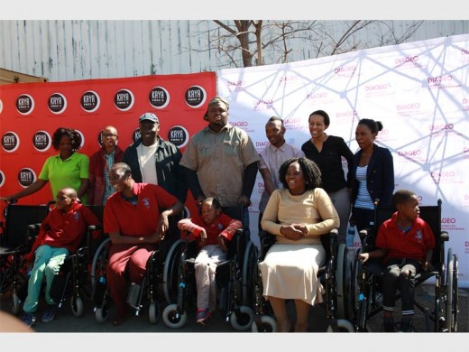PILLSBURY staff and children with their new wheelchairs.