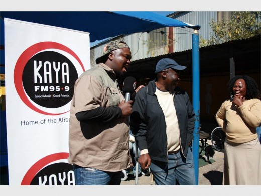 KAYA FM show host Skhumba talks to Alex Disability Movement founder, Jerry Ntimbane and Pillsbury centre manager, Angelinah Mpjana soon after the delivery of the wheelchairs.