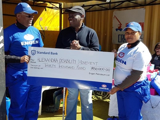 ENGEN's Mntu Nduvane; Alexandra Disability Movement founder, Jerry Ntimbane and Engen's Thandi Manqana at the handover of the cheque to the movement.