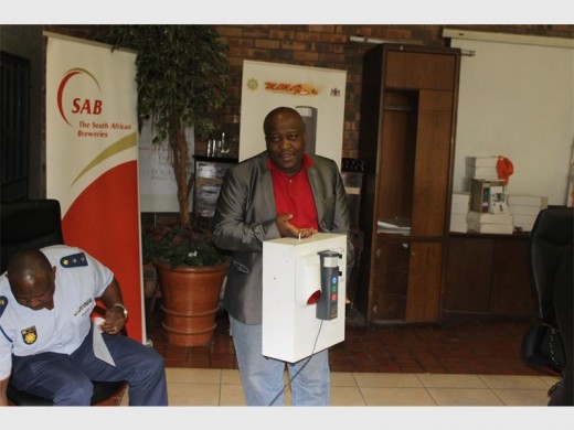 The community safety alarm system displayed by Thami Molefe of Memeza Community Safety Organisation.