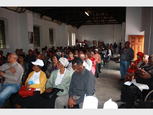 Alpoa members listen attentively during a feedback meeting at the Roman Catholic Church hall.