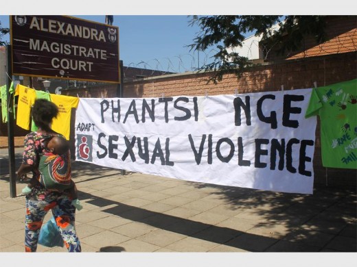 An anti-rape and abuse banner at the Alex Magistrates' Court where a fatal child rape case is being heard.