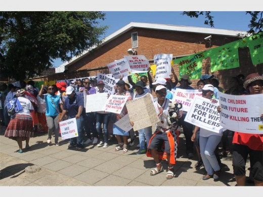 Protesters at a fatal child rape hearing at the Alex Magistrates' Court.
