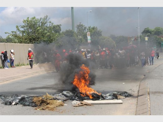 Smoke hides protesting Central Johannesburg College students.