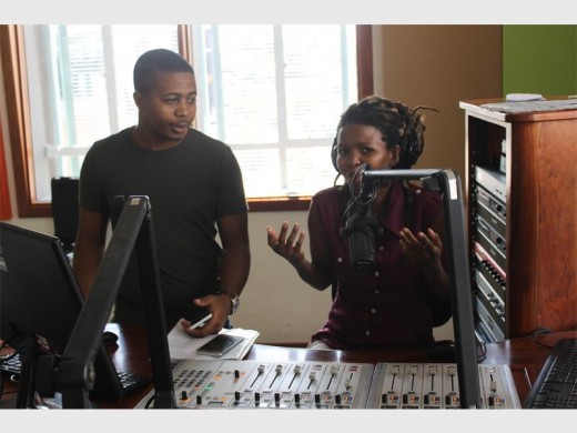 Alex FM Radio Station manager Takalani Nemangowe listens to the Real Deal programme presenter Matsatsi Mokoena.