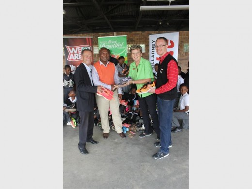 Caxton's Norman Dawe, Skeen Primary School principal Phillemon Mashishi, Spar's Marlene Gunter and Jonathan Pope.